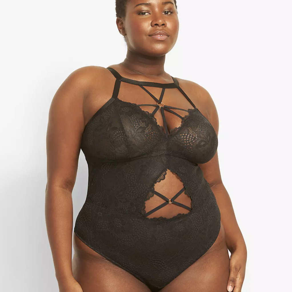 Good Bodies' Amazing Places for Plus-Size Lingerie - Cacique Black Strappy and Lacy Bodysuit on model with short hair