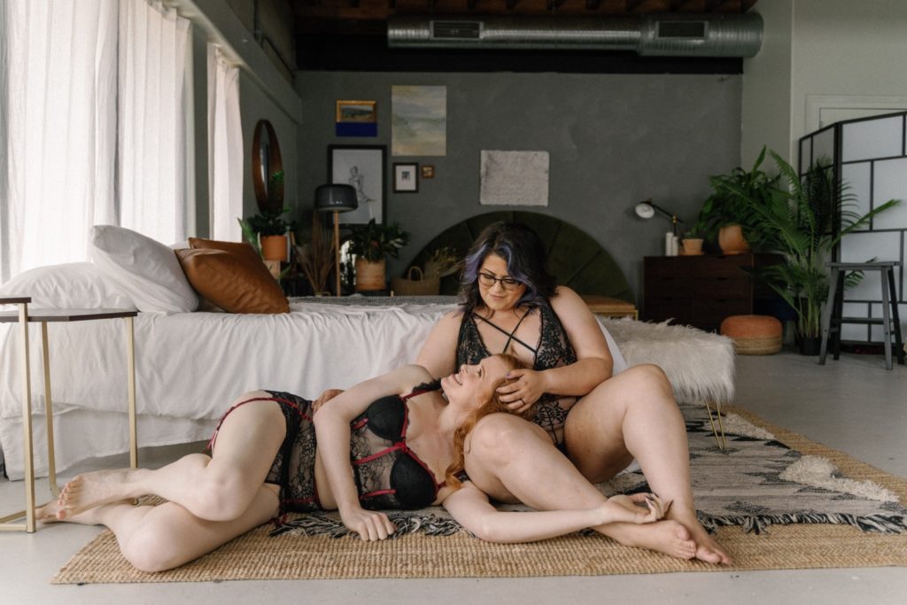 Couples boudoir session cuddled on the floor